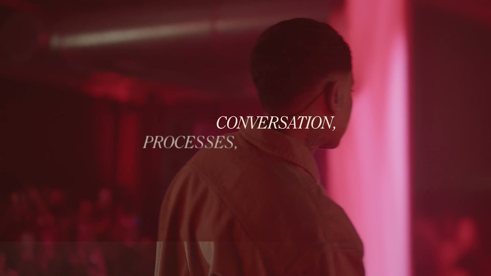 The words Conversation, Processes over a figure in warm light